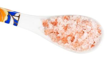 top view of chinese spoon with pink Salt close up photo
