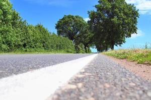 Beautiful view on countryside roads with fields and trees in northern europe photo