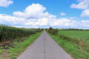 Beautiful view on countryside roads with fields and trees in northern europe photo