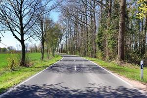 Beautiful view on countryside roads with fields and trees in northern europe photo