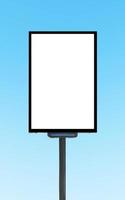 Pole billboard with mock up white screen on blue background and clipping path photo