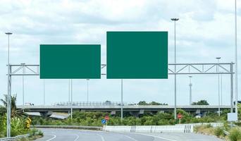 Mockup green road sign on highway road photo