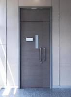 Gray metal door with modern background photo