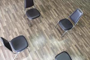 Empty four chairs forming a circle Group therapy photo