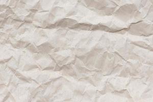 Brown crumpled paper texture background photo