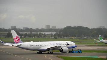 AMSTERDAM, THE NETHERLANDS JULY 29, 2017 - China Airlines Airbus A350 B 18907 towing before departure, Shiphol Airport, Amsterdam, Holland video