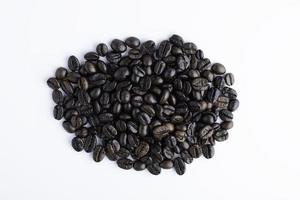 Coffee beans isolated on white background, top view. photo