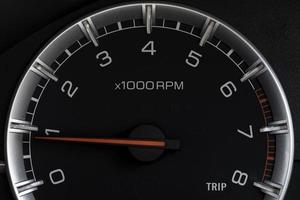 Tachometer Gauge of Starting Car, close-up macro photo. photo