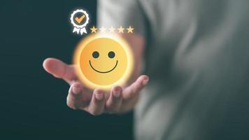 Male consumers rate their satisfaction and rate and review them online. Customer Experience Survey Concepts for Services and Products and Customer Engagement photo