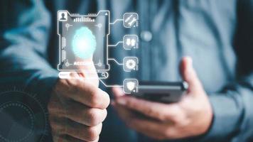 Approved cybersecurity and login authentication With AI database technology, business people use fingerprints to unlock the system and provide access, connection, security and online privacy. photo