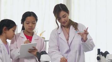 Asian schoolgirls are studying science and technology in a lab. Teachers teach science to students for learning process skills. video