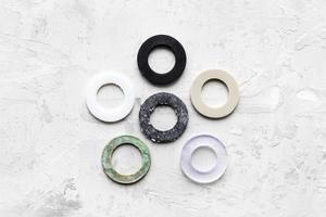 various gaskets for piping water systems on gray photo