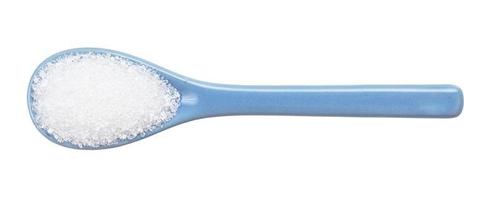 crystalline citric acid in ceramic spoon isolated photo