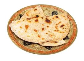 indian tandoori roti on brass plate isolated photo