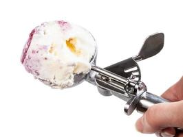 top view of disher scoop with ice cream isolated photo