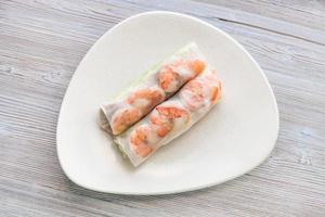Vietnamese nem roll with shrimps on plate on table photo