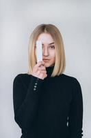 Portrait of a pretty smiling woman posing isolated photo