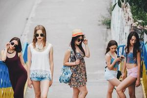 Five young beautiful girls in the city photo