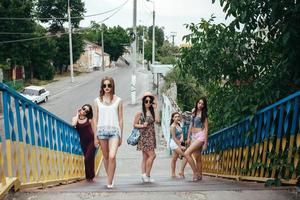 Five young beautiful girls in the city photo