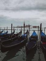 Gondolas moored by Saint Mark square photo