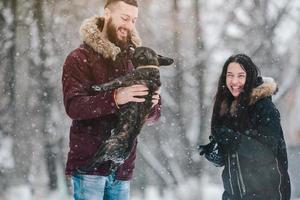 Young couple having fun on the snow photo