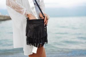 beautiful young girl with a handbag photo