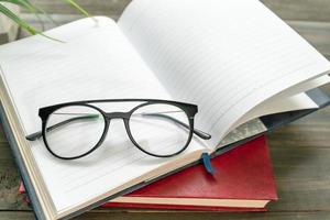 Reading glasses put on open book