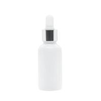 White glass dropper serum bottle on white background photo