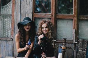 Two vintage witches perform magic ritual photo