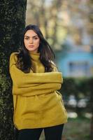 Fashion girl posing in the park photo