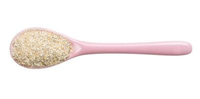top view of ceramic spoon with rye bran isolated photo