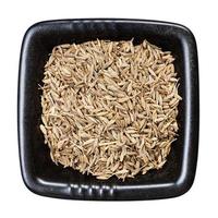 cumin cuminum cyminum seeds in bowl isolated photo