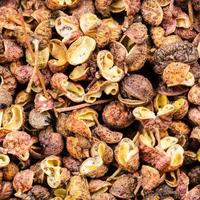 dried pink sichuan pepper close up photo