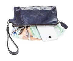 purse bag with phone, door keys and euros isolated photo