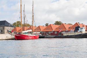 new houses and living boats on canal photo