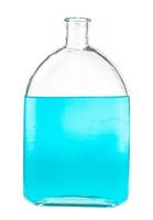 blue ink solution in water in glass flask isolated photo