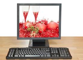 red balls and glasses on screen of desktop PC photo