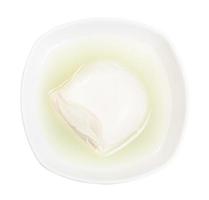 fresh mozzarella italian cheese with brine in bowl photo