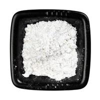 top view of vanilla sugar in black bowl isolated photo