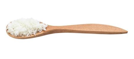 coconut flakes in wooden spoon isolated photo