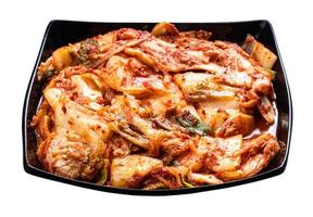 korean appetizer kimchi in black bowl isolated photo