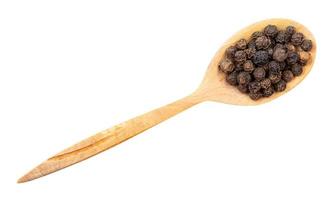 top view of hainan black pepper in wood spoon photo