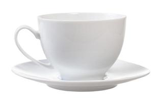 side view of white porcelain cup and saucer photo