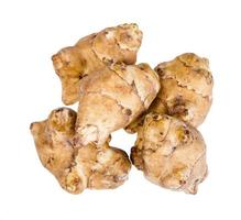 pile from raw tubers of jerusalem artichoke photo