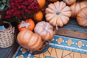 Autumn decoration with pumpkins and flowers on a street in a European city photo