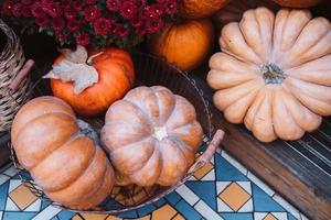 Autumn decoration with pumpkins and flowers on a street in a European city photo