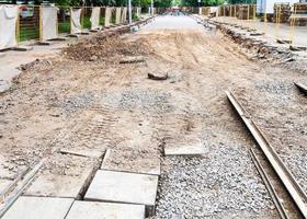 broken old tram road and laying of new rails photo