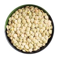 whole light green lentils in round bowl isolated photo