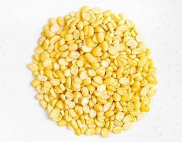 pile of raw moong dal split green mung beans photo