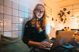 Woman works at a cafe in the evening photo